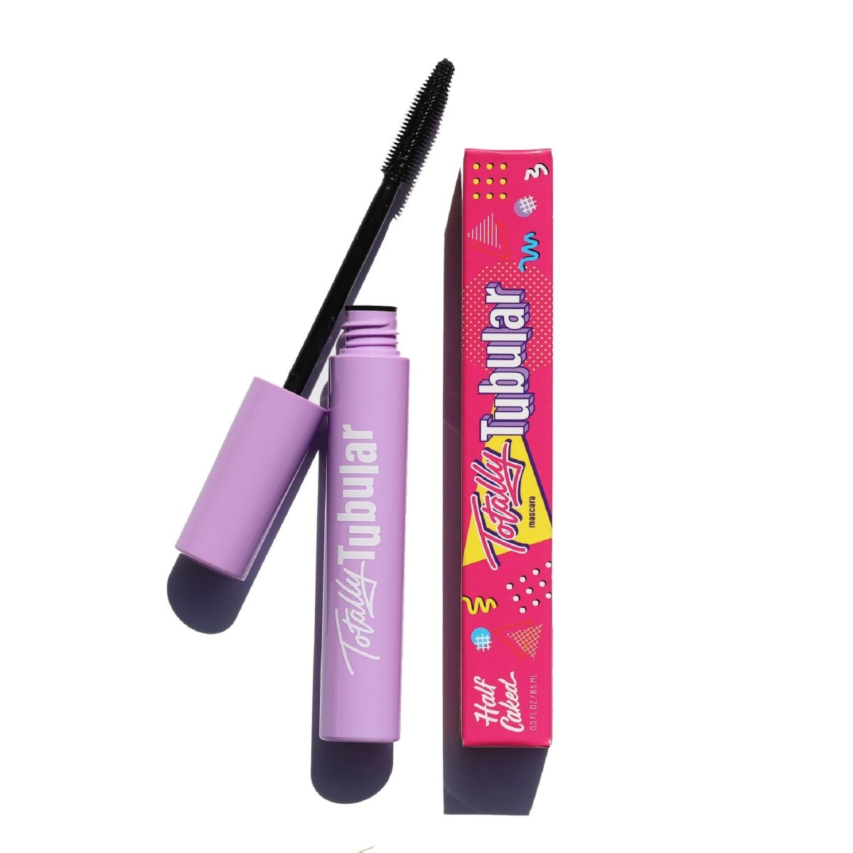 open purple mascara tube with black plastic cone applicator and pink box - totally tubular mascara, the heights - half caked makeup