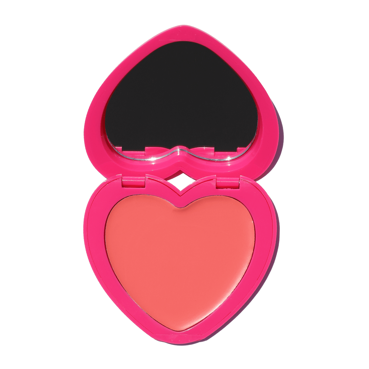 Heart-shaped compact of Candy Paint Cheek + Lip Tint in a soft peach shade with a built-in mirror, perfect for adding a touch of dewy, radiant color to cheeks and lips.