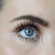 Close-up of an eye with long, defined lashes coated in Totally Tubular Tubing Mascara.