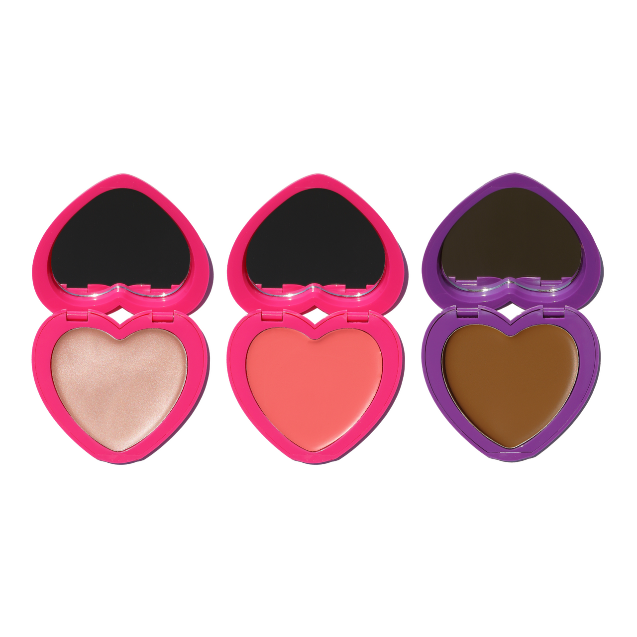Candy Paint Trifecta set with heart-shaped compacts: cream highlighter, blush, and bronzer.
