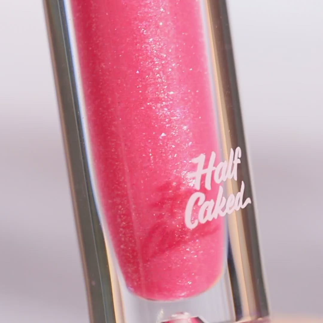 Shimmery pink lip gloss in a clear tube with heart - Half Caked Instant Crush - Pinky Ring