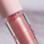 Pink and gold lip gloss in a clear tube - Half Caked Instant Crush - Rich Rich