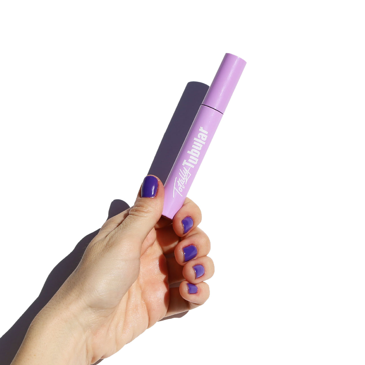 purple mascara tube with curved black applicator - totally tubular mascara, the ultimate - half caked makeup