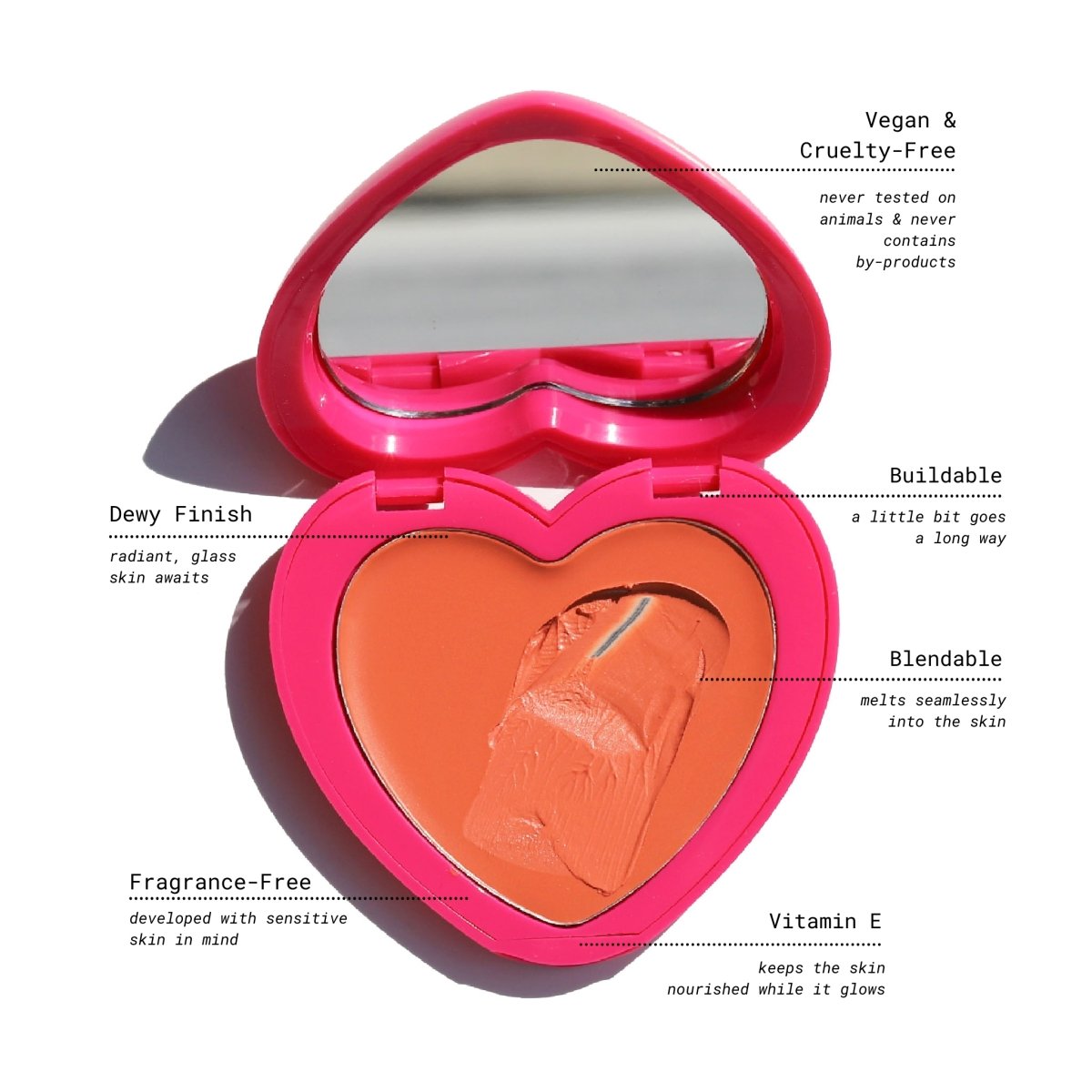 open pink heart-shaped compact with mirror and orange pan key benefits - candy paint trifecta - half caked makeup