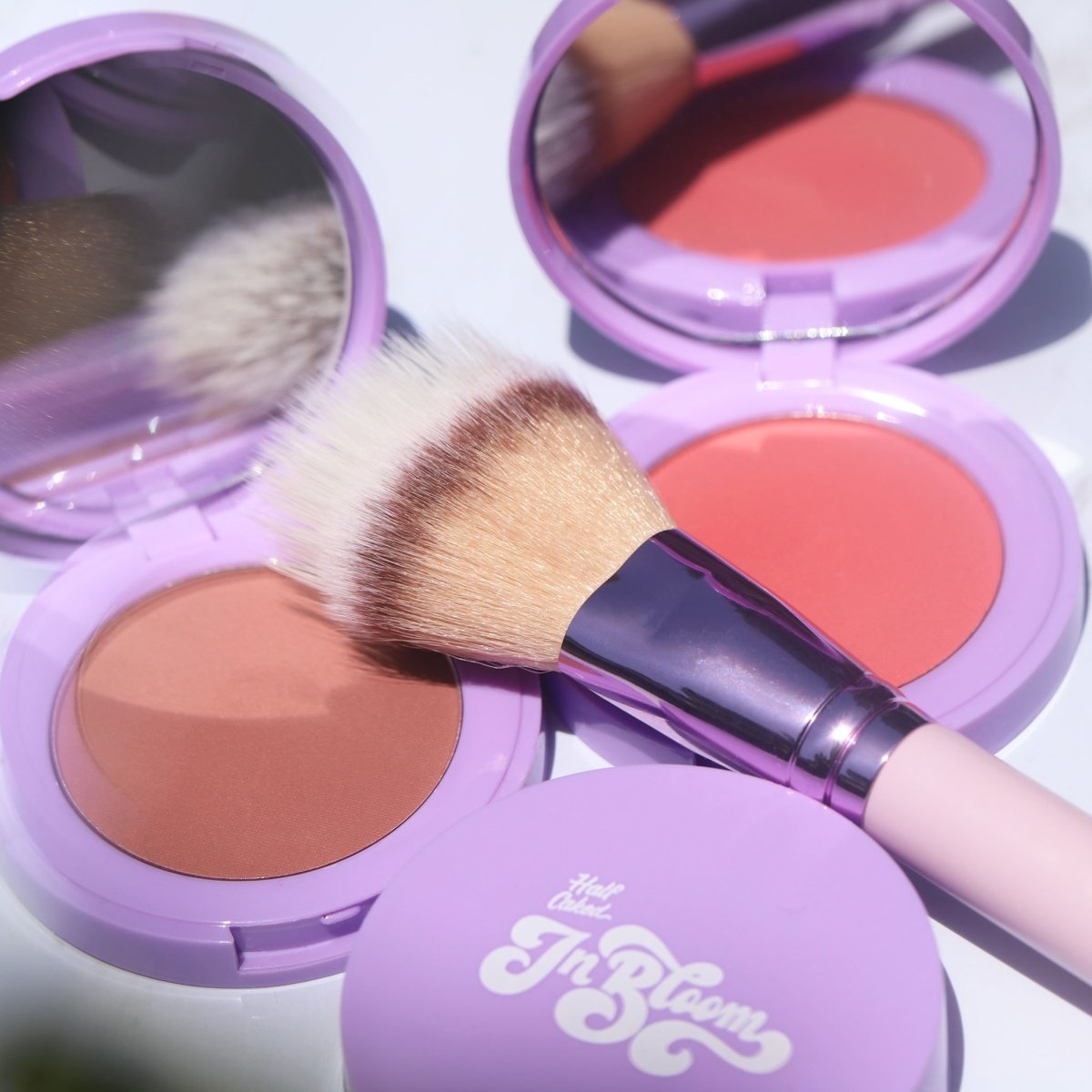 shiny purple blush brush on purple compact with mirror - duo fiber brush - half caked makeup