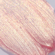 Macro swatch of pink lip gloss with gold shimmers - Instant Crush - Rich Rich - Half Caked