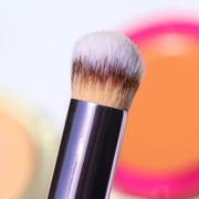 closeup of shiny purple concealer brush with tan brown and white hairs - Mini Buffer Brush - Half Caked
