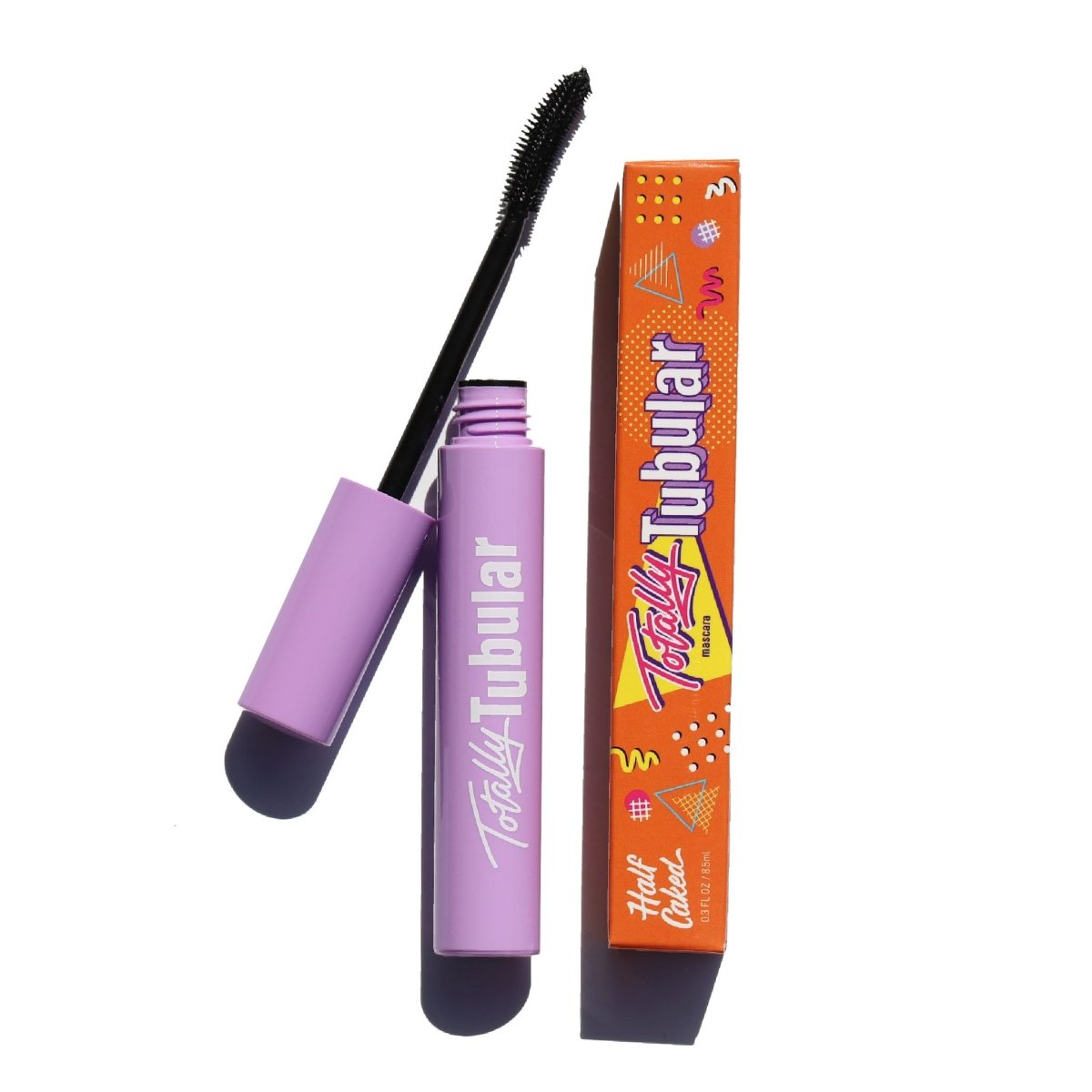 open purple mascara tube with black plastic curved applicator and orange box - totally tubular bundle, the ultimate - half caked makeup