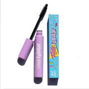 open purple mascara tube with black wire bushy applicator and blue box - totally tubular mascara, the realest - half caked makeup